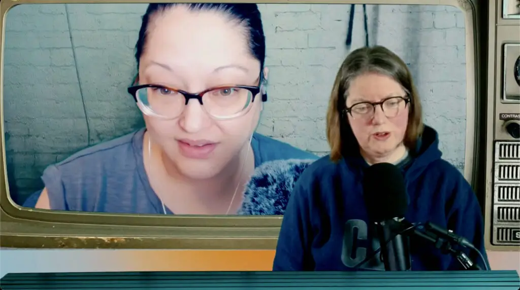 YouTube screenshot from Your Improv Brain Ep23 about an active Improv Brain, Sabrina in a faux TV and jen in front with a microphone and blue desk.