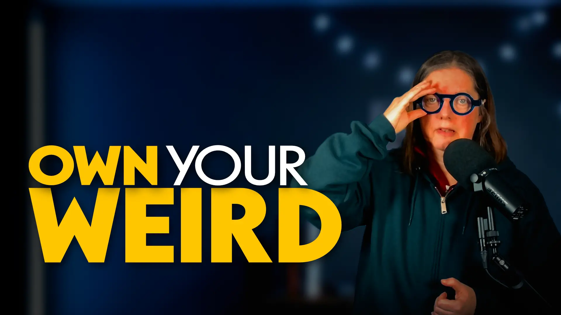 Jen standing against dark gradient background next to yellow and white text that reads "own your weird"
