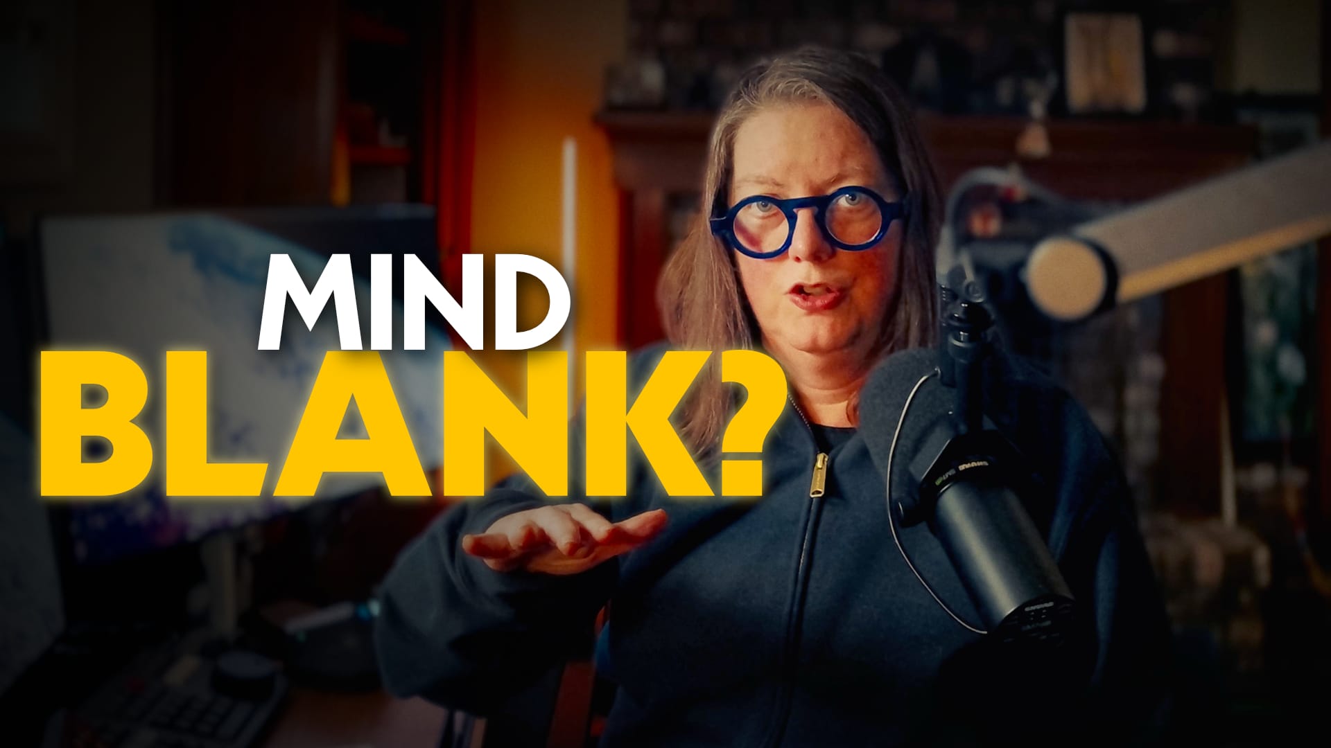 jen behind a microphone with the text "Mind blank?"